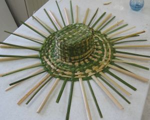 weaving a cattail hat